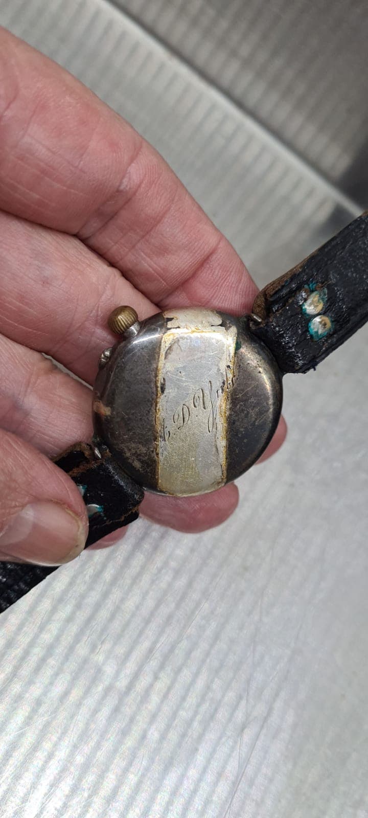 Engraved case back of the watch reading A. D. Y.